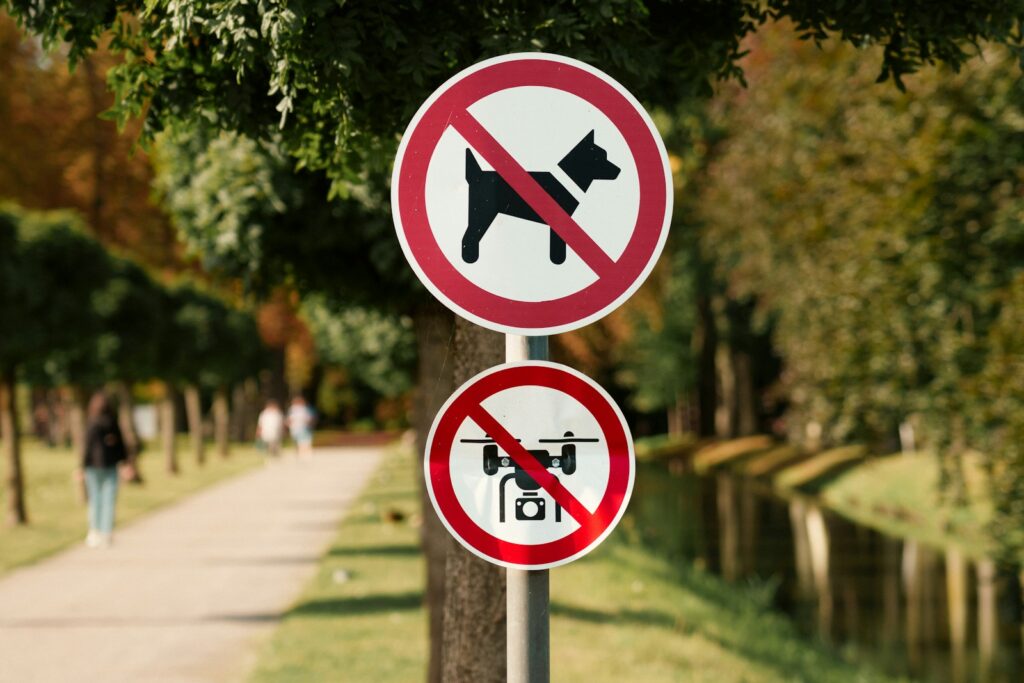 No dogs or drones allowed signs