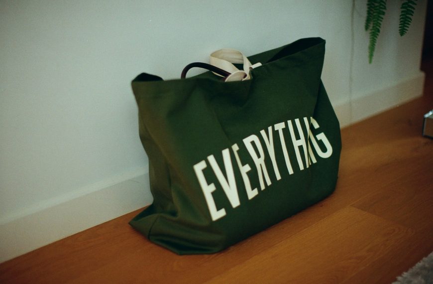 Green canvas bag with "everything" written on it.