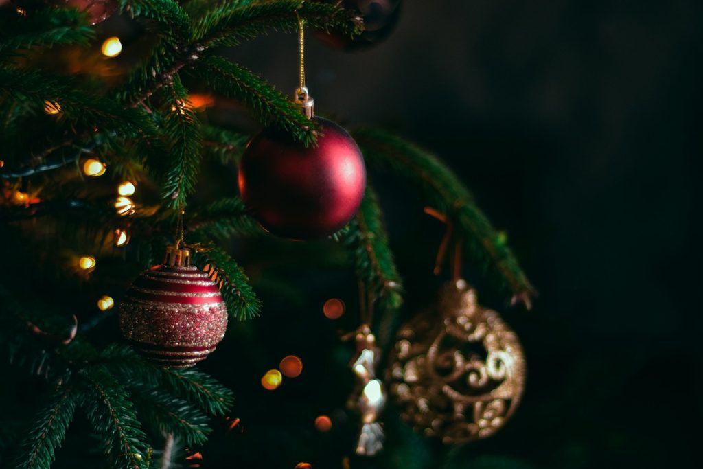 a christmas tree with ornaments hanging from it
