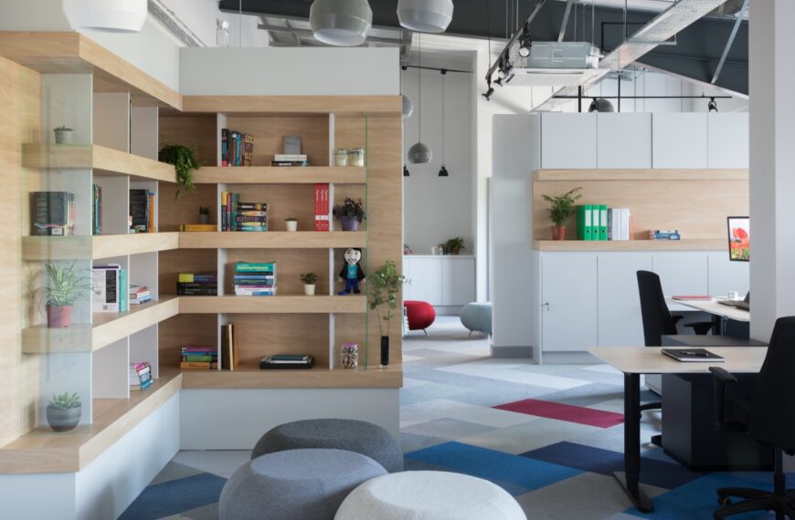 white wooden shelf with books and red ball