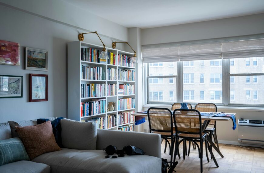 a living room with a bookcase and a couch
