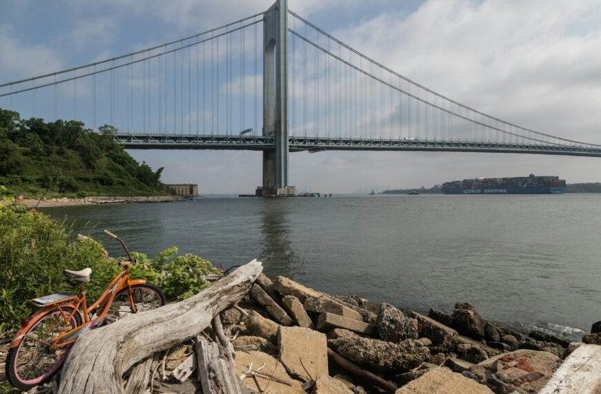 a bike is parked next to a pile of rocks