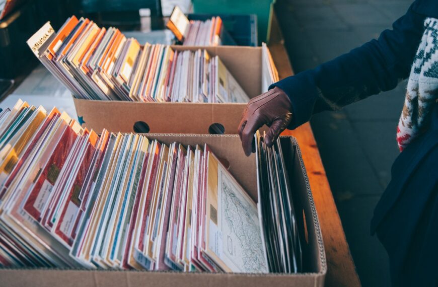 person touching book box