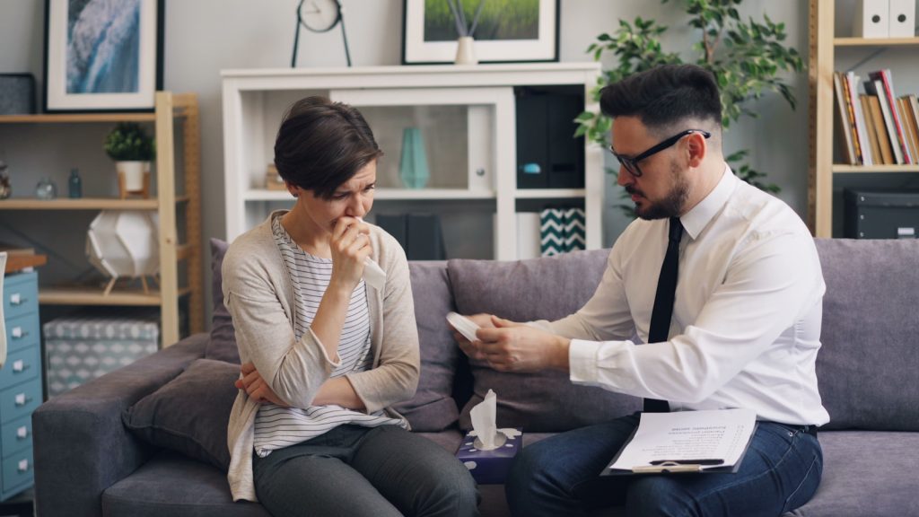 a man and a woman sitting on a couch