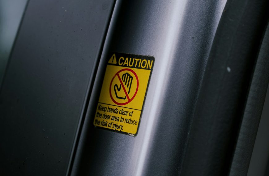 a caution sign on the side of a vehicle