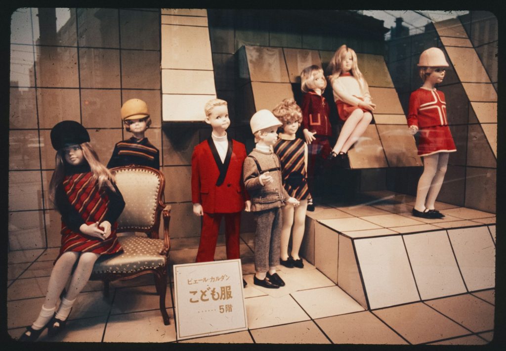 A group of mannequins sitting on top of a set of steps