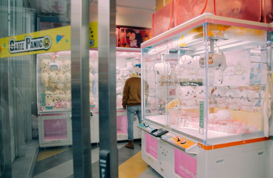 a man standing in front of a display case in a store