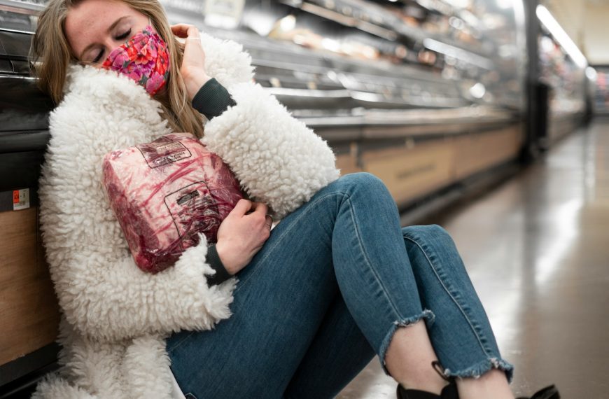 woman in blue denim jeans lying on white fur textile