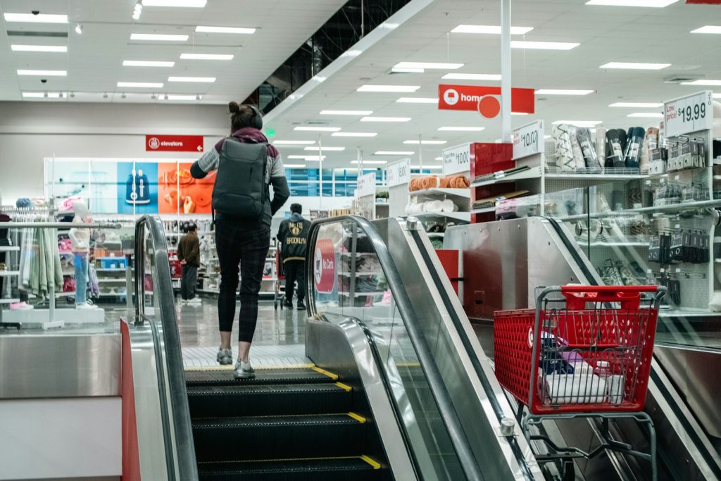 Person walks up the escalator in a target store.