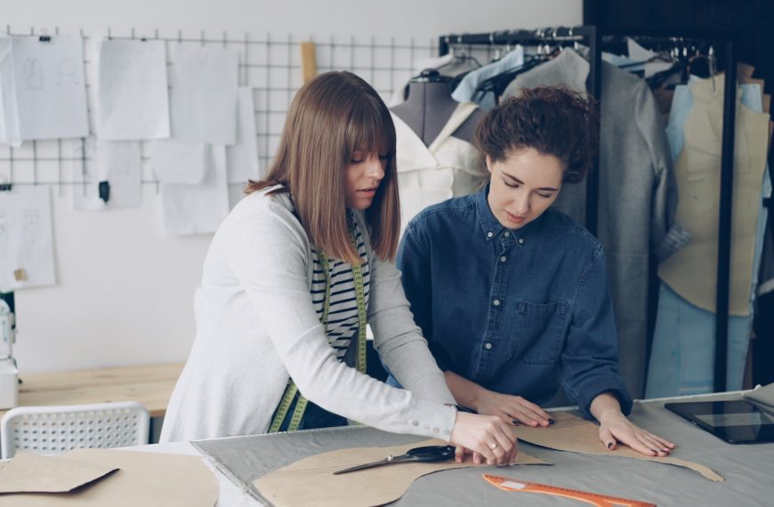 Fashion designers work together on a project.