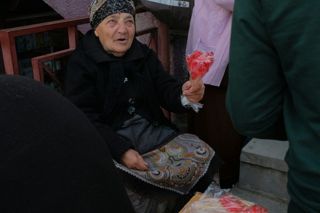 A woman sitting on the steps of a building