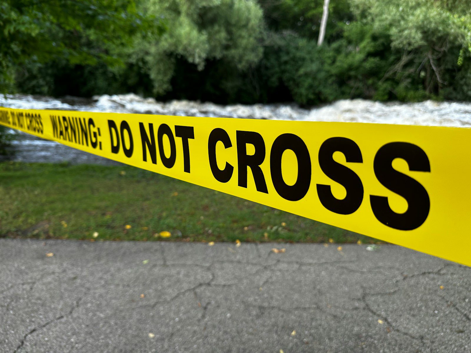 Yellow caution tape with "do not cross" text