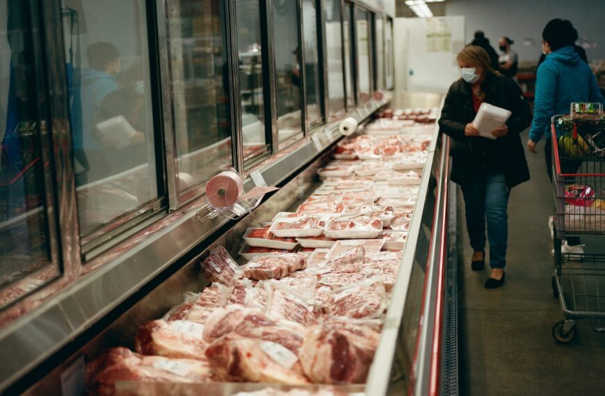 a line of meat in a grocery store