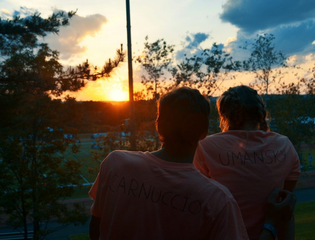 a couple of people standing next to each other