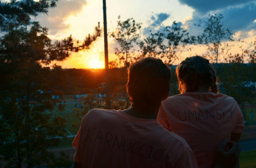 a couple of people standing next to each other