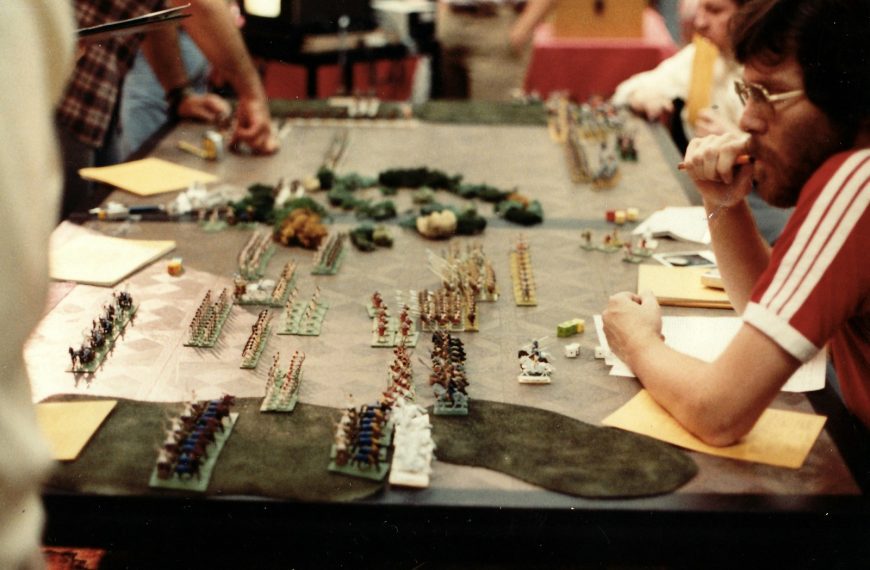 a group of people sitting around a table playing a game