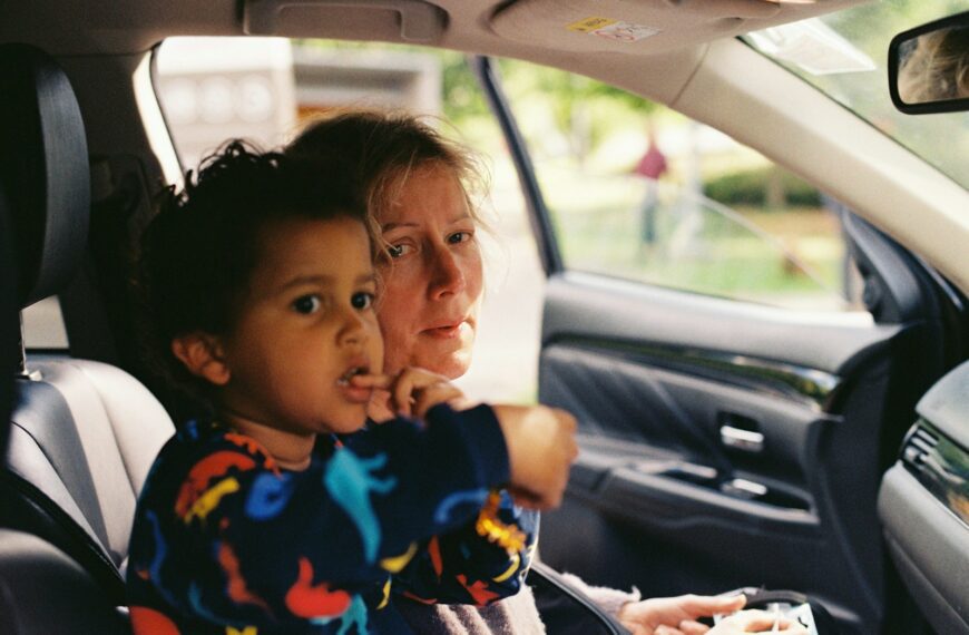 a person and a child in a car