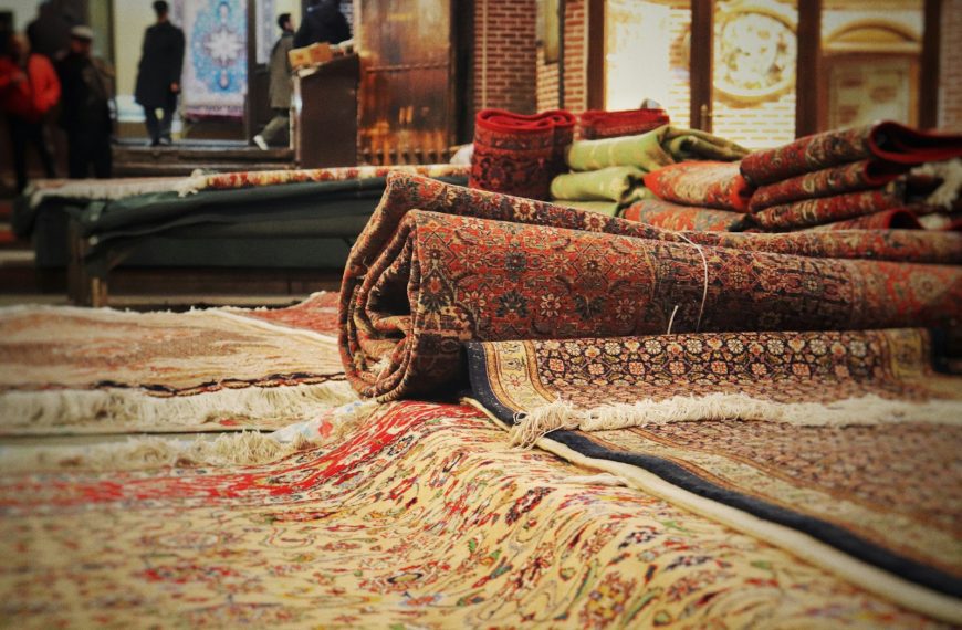 A pile of rugs sitting on top of a floor