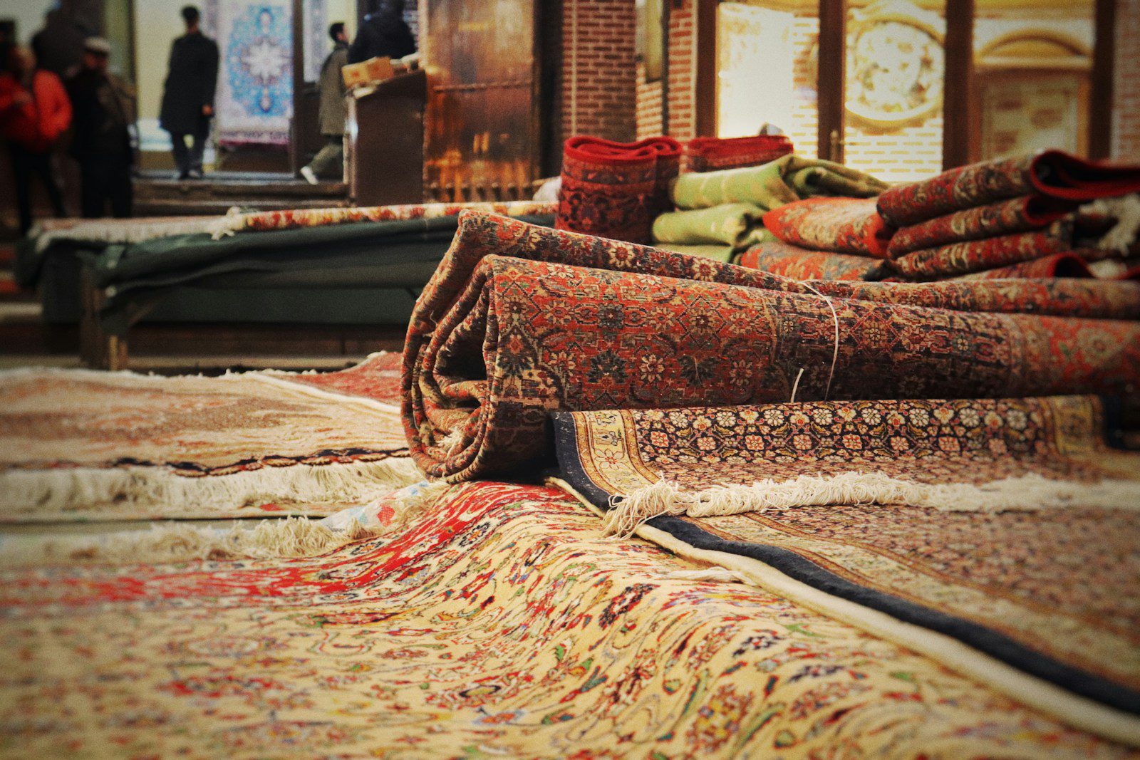 A pile of rugs sitting on top of a floor