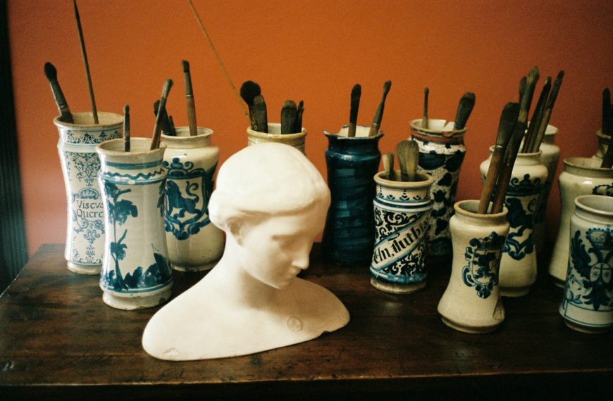 white ceramic vase on brown wooden table
