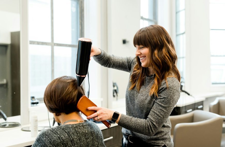 woman holding hair dryer