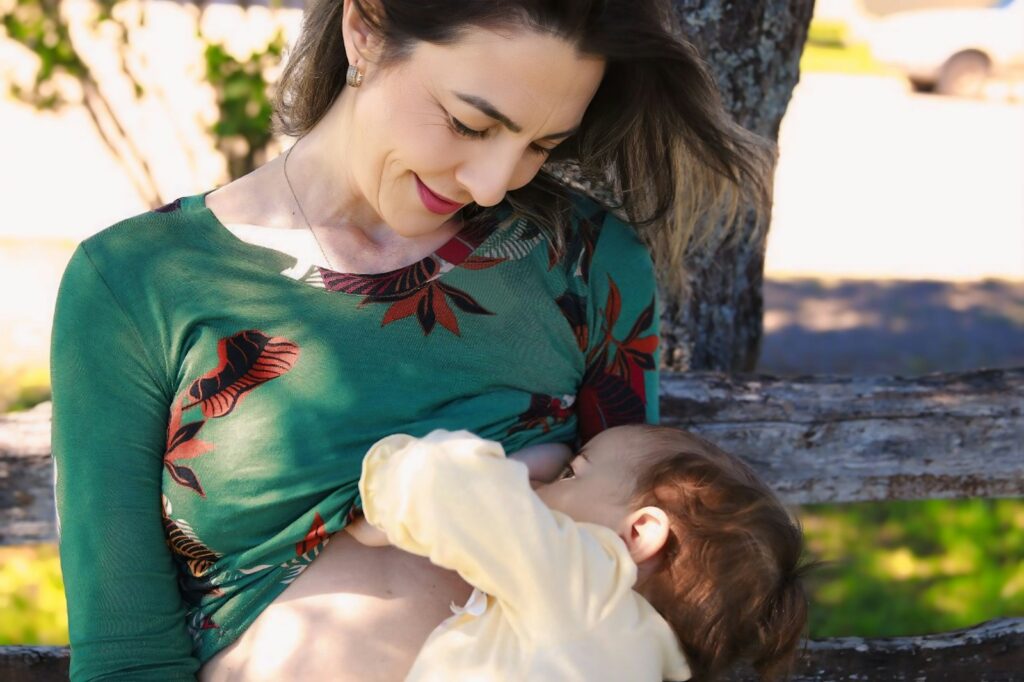 A woman holding a baby in her arms