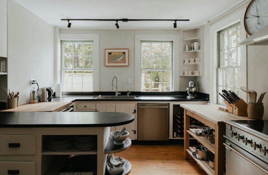 a kitchen with a clock on the wall