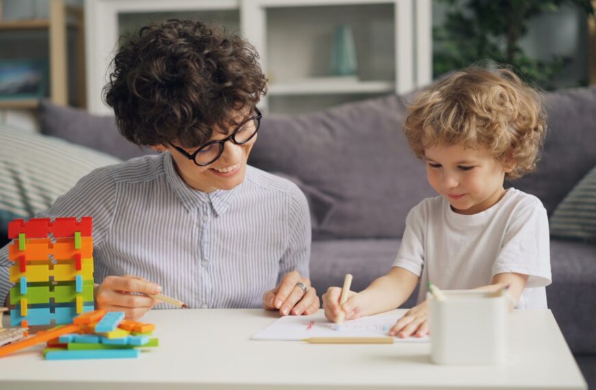 a woman and a child sitting at a table