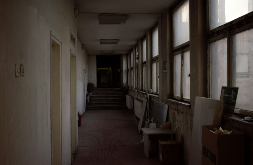a long hallway with a bunch of windows