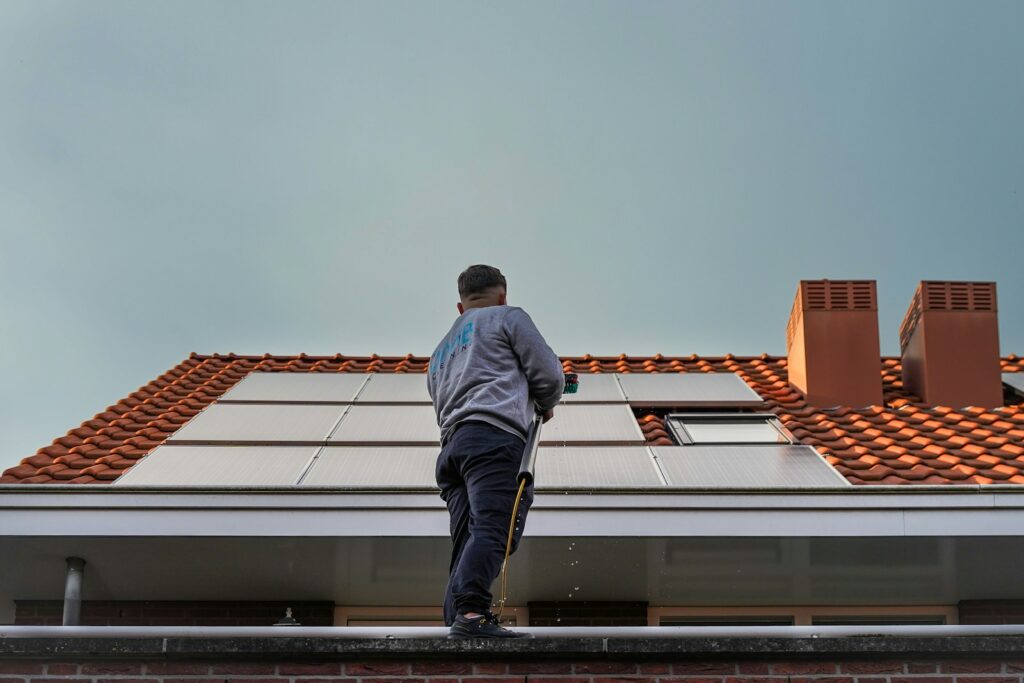 A man standing on the roof of a building