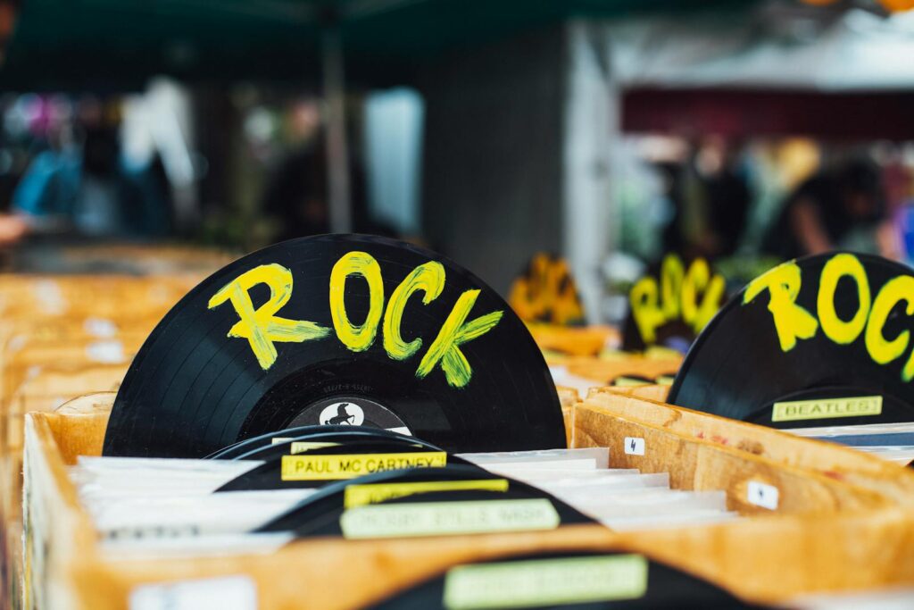 Colorful vinyl records labeled 'Rock' in a vintage music shop, perfect for music enthusiasts.
