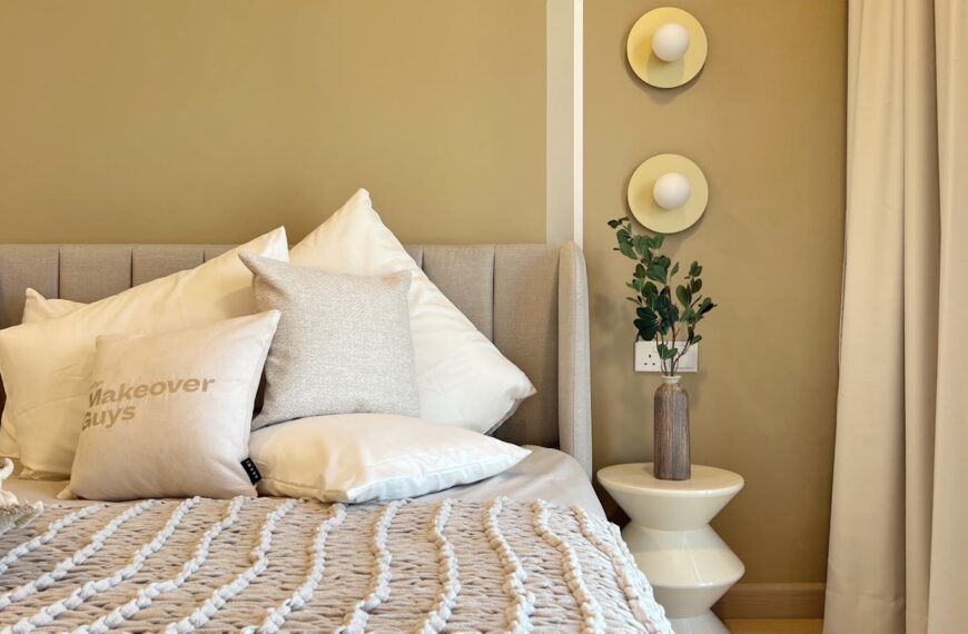 A modern bedroom featuring a comfortable bed and elegant interior design elements, perfect for a cozy ambience.