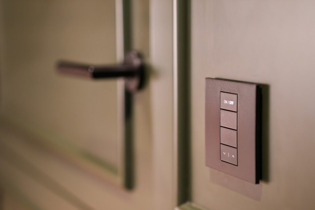 A close up of a light switch on a wall