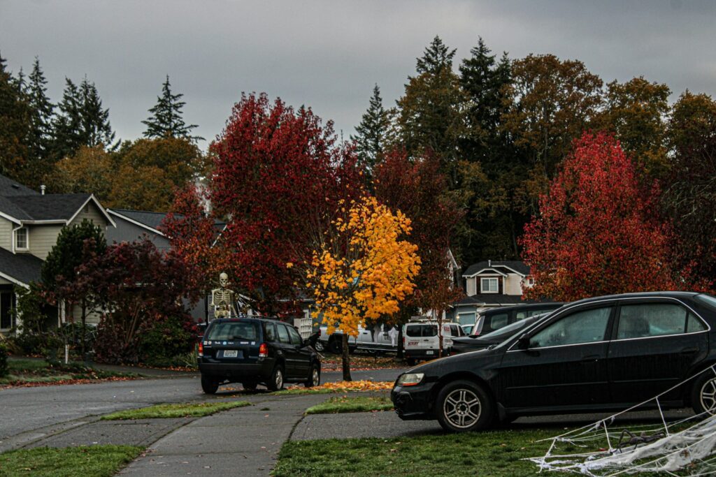 A black car parked on the side of a road