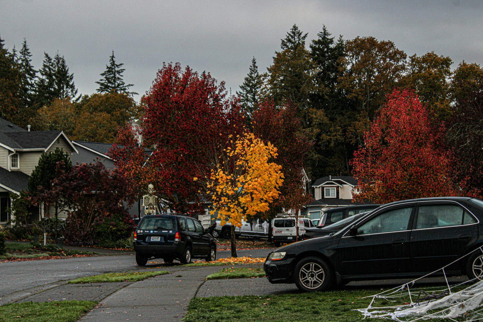 A black car parked on the side of a road
