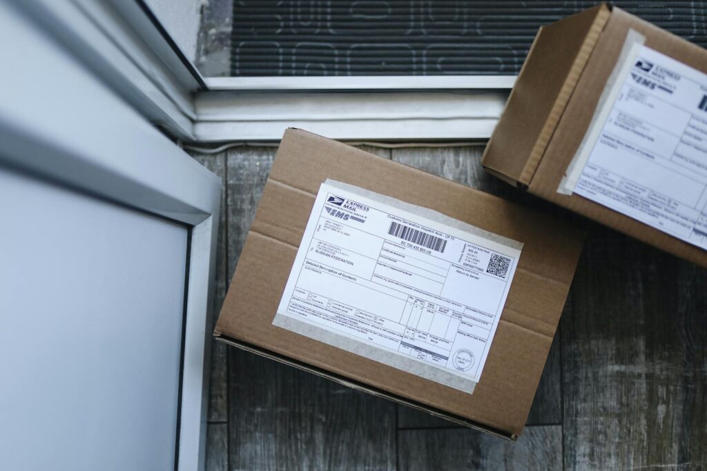 Close-up of a package delivery box on a doorstep, highlighting logistics concepts.