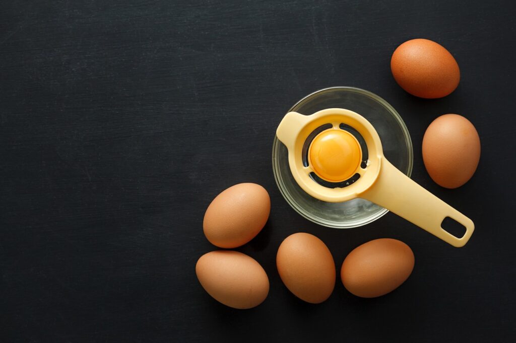 bowl, breakfast, cooking, egg, fresh, kitchen, organic, raw, separator, table, top view, yellow, yolk
