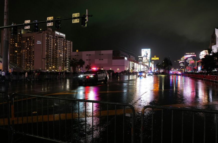 City street at night with wet reflections