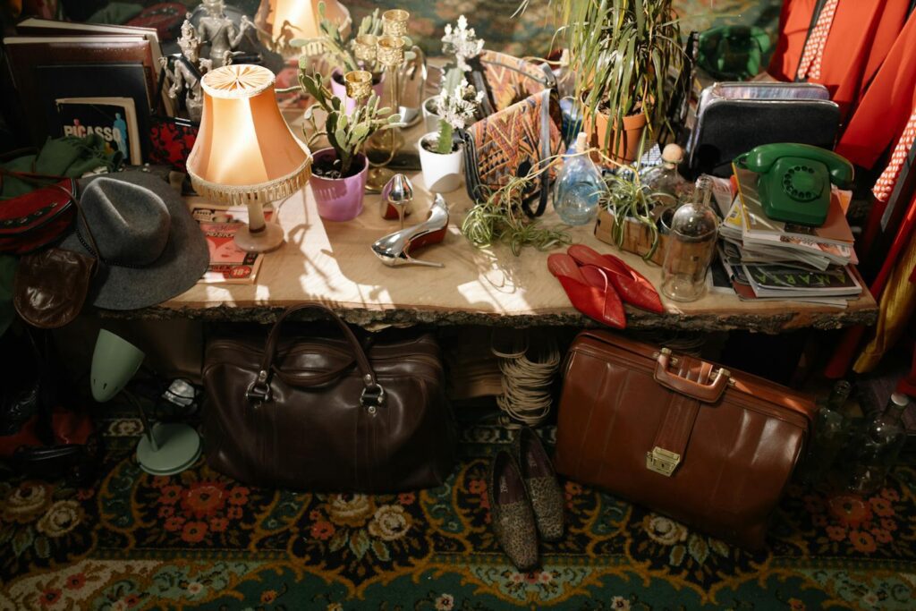 A warm, cluttered secondhand store with vintage items and eclectic antiques on display.