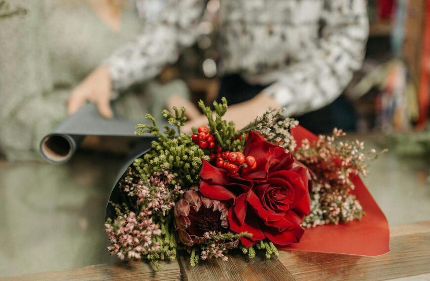 A red rose bouquet being arranged, perfect for romantic occasions and gifts.