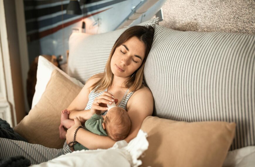 Peaceful moment of a mother and newborn baby relaxing at home.