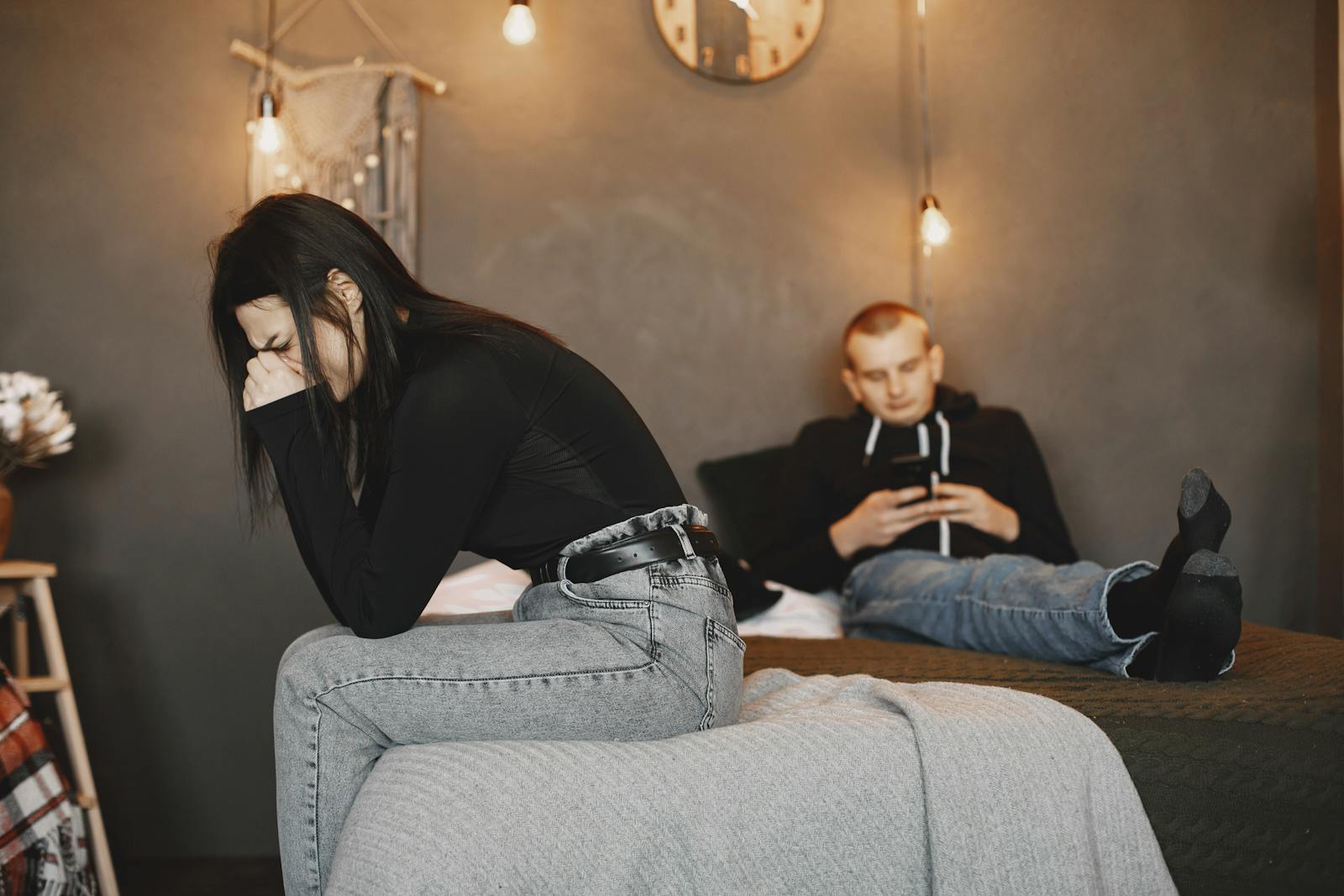 A couple experiencing tension and distance, highlighting relationship challenges.