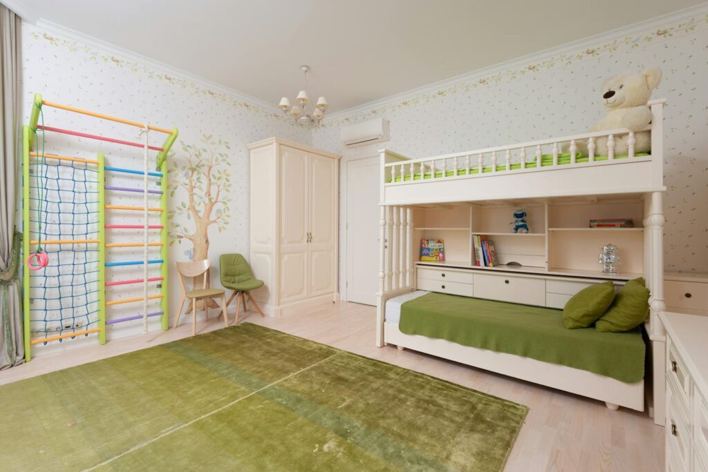 Bright and spacious children's bedroom with bunk bed and play area.