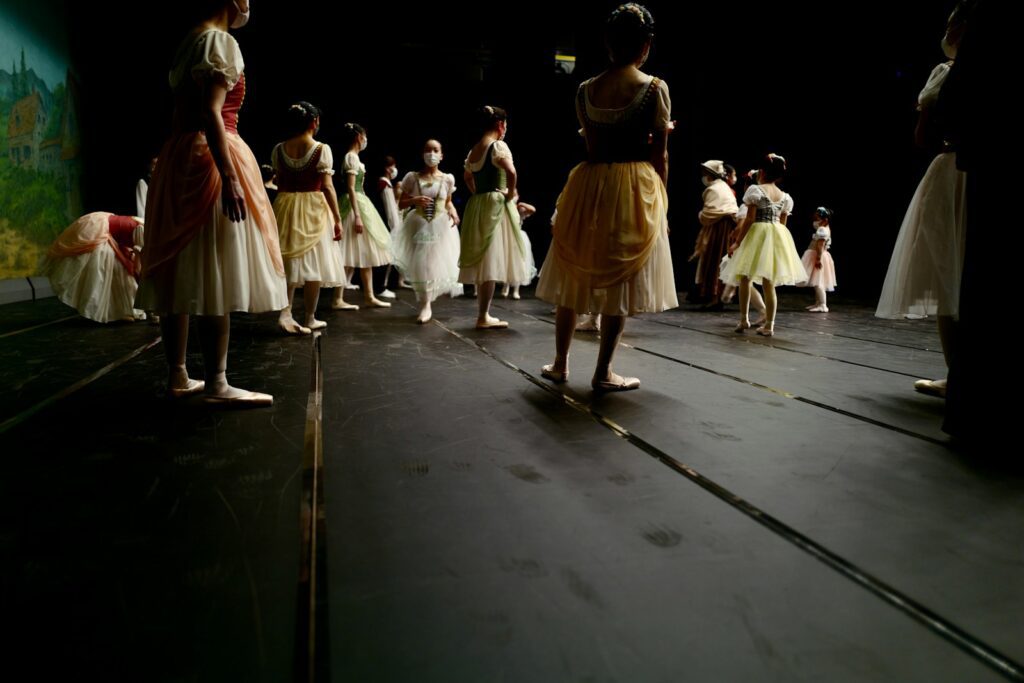 a group of children standing on a stage