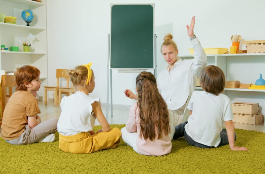 Preschool teacher interacting with children in a classroom, fostering an engaging and educational environment.