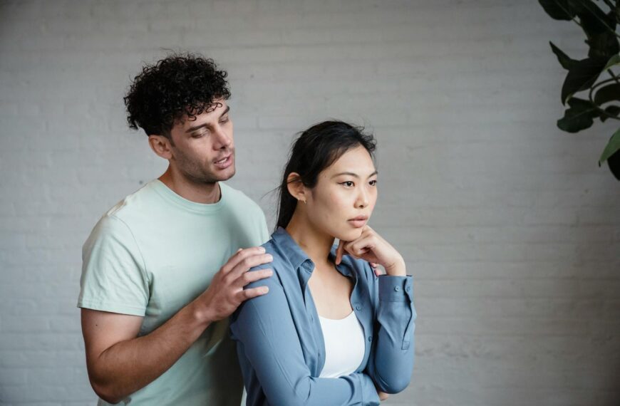 A couple engaged in emotional discussion indoors, reflecting relationship dynamics.