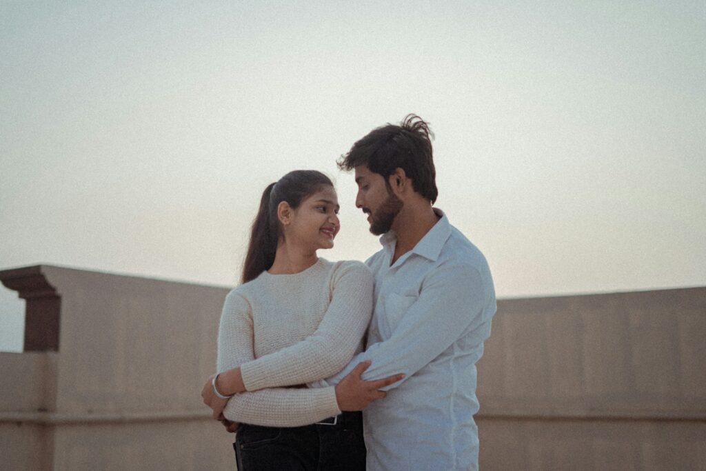 a man and a woman standing next to each other