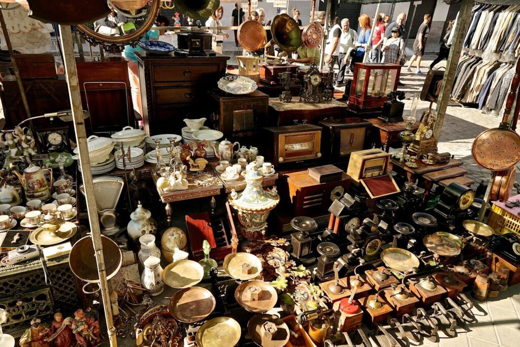 a table filled with lots of antique items