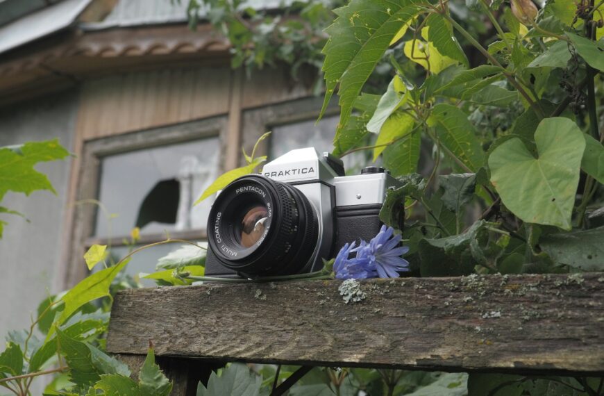 a camera sitting on top of a wooden bench