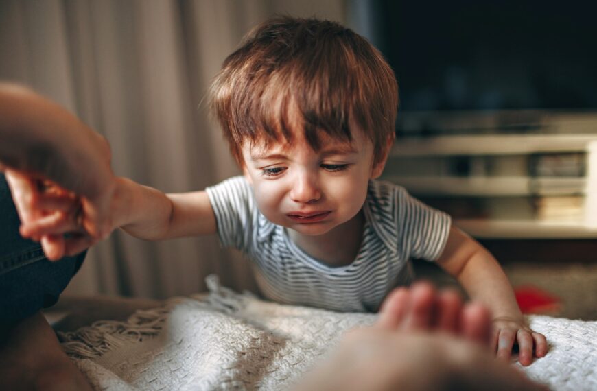 boy in black and white striped crew neck t-shirt